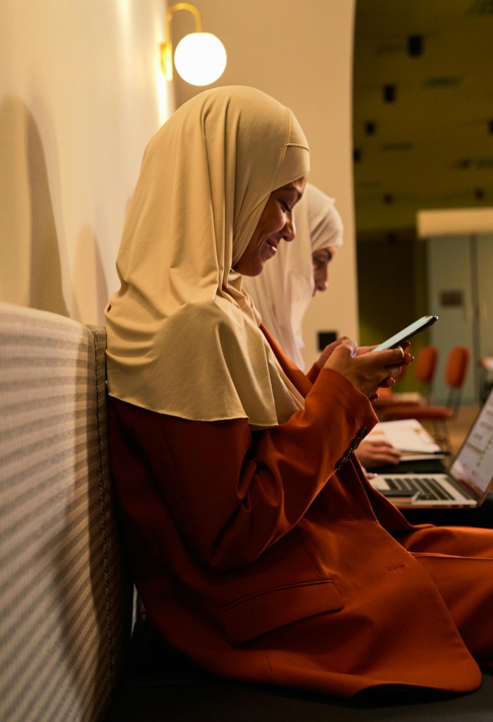 Woman Smiling while Texting