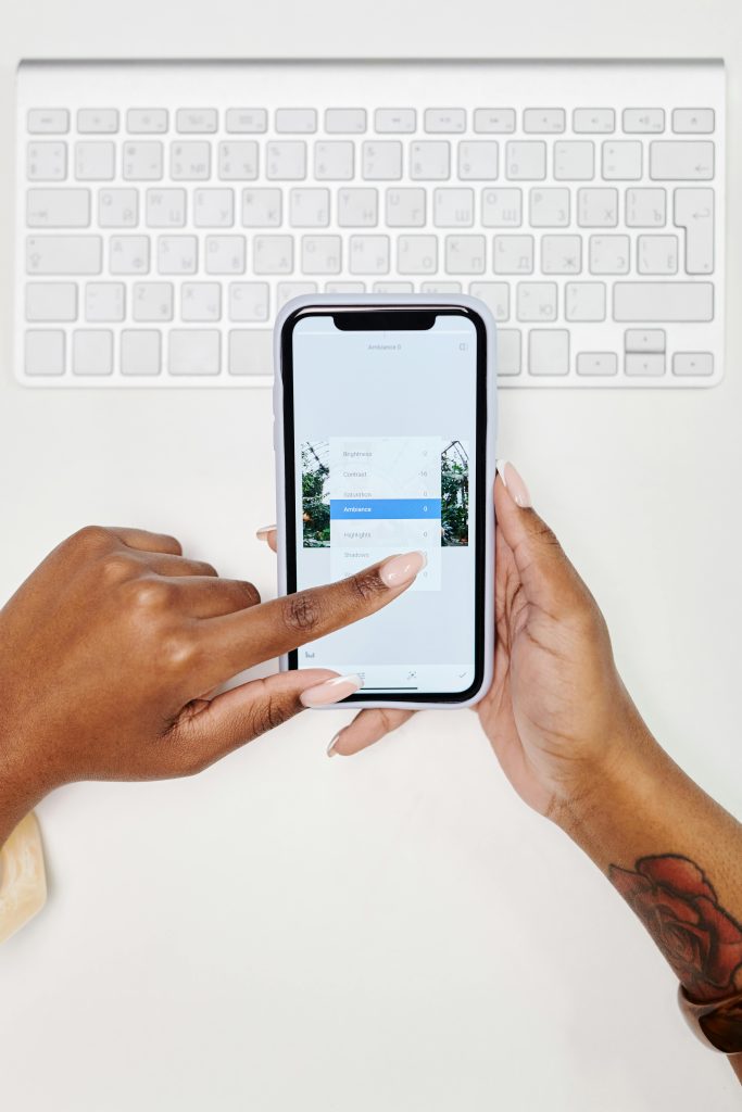 Overhead Shot of a Person's Hands Using a Cell Phone